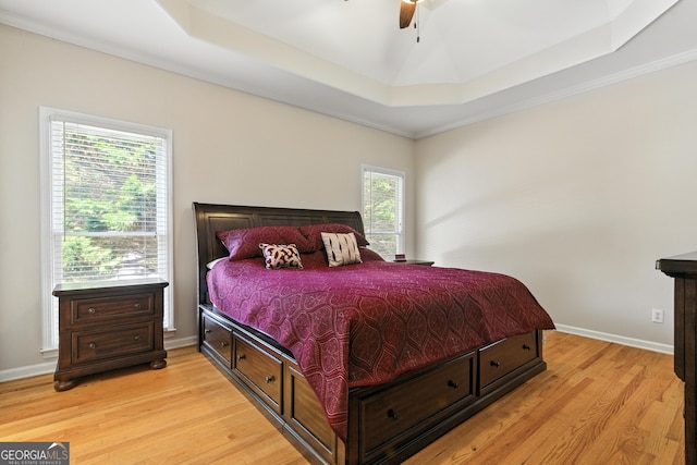 2832 Windrush Dr, Buford, GA 30518 - bedroom featuring a tray ceiling, light wood-style floors, ceiling fan, and crown molding