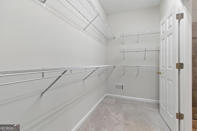 2832 Windrush Dr, Buford, GA 30518 - walk in closet featuring carpet