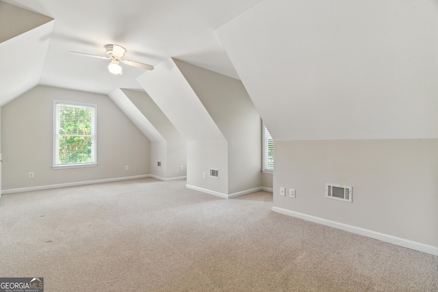 2832 Windrush Dr, Buford, GA 30518 - additional living space with light colored carpet, ceiling fan, and lofted ceiling