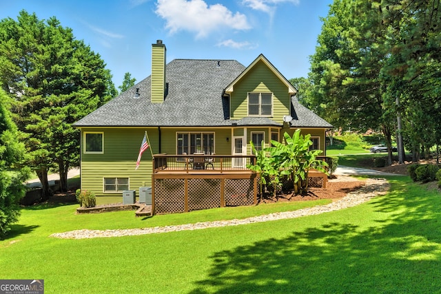 2832 Windrush Dr, Buford, GA 30518 - rear view of property with a deck, a lawn, a chimney, and roof with shingles