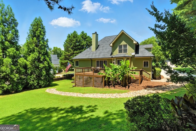 2832 Windrush Dr, Buford, GA 30518 - rear view of property with a wooden deck, a lawn, a shingled roof, and a chimney