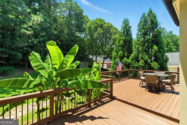 2832 Windrush Dr, Buford, GA 30518 - deck with outdoor dining area and view of wooded area