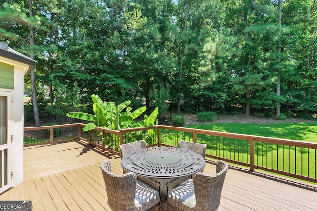 2832 Windrush Dr, Buford, GA 30518 - deck featuring outdoor dining space, a lawn, and view of scattered trees