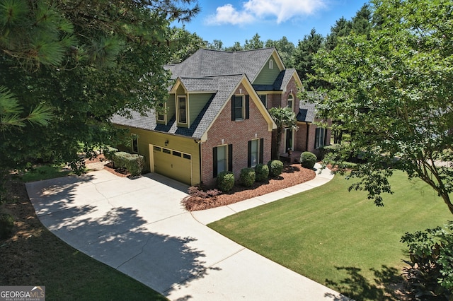 2832 Windrush Dr, Buford, GA 30518 - view of front of house with brick siding, concrete driveway, an attached garage, a front lawn, and a shingled roof