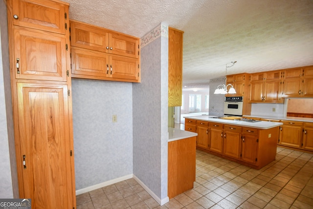 2722 Hidden Valley Rd, Hiawassee, GA 30546 - kitchen featuring white appliances, light countertops, wallpapered walls, a textured ceiling, and light tile patterned flooring