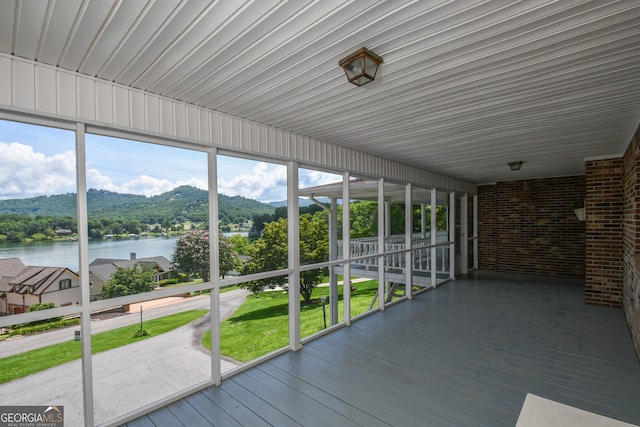 2722 Hidden Valley Rd, Hiawassee, GA 30546 - unfurnished sunroom with a water view