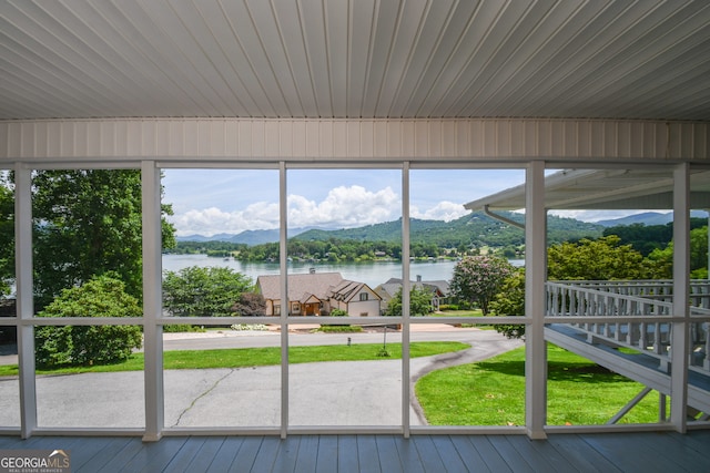 2722 Hidden Valley Rd, Hiawassee, GA 30546 - unfurnished sunroom with a water and mountain view