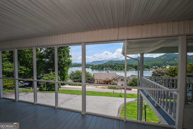 2722 Hidden Valley Rd, Hiawassee, GA 30546 - unfurnished sunroom featuring a water view