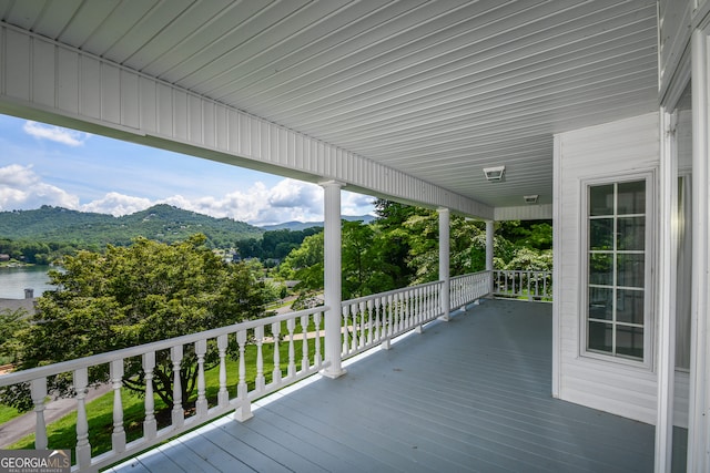 2722 Hidden Valley Rd, Hiawassee, GA 30546 - wooden terrace with a water and mountain view