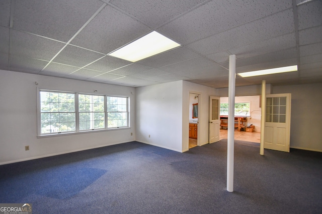 2722 Hidden Valley Rd, Hiawassee, GA 30546 - unfurnished room with a drop ceiling, dark carpet, and healthy amount of natural light