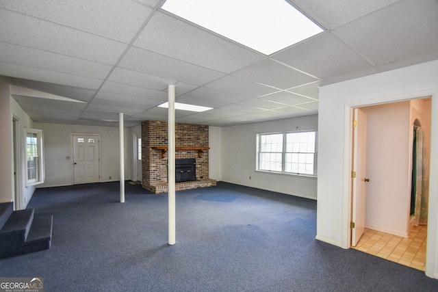 2722 Hidden Valley Rd, Hiawassee, GA 30546 - basement with a paneled ceiling, a fireplace, and carpet floors