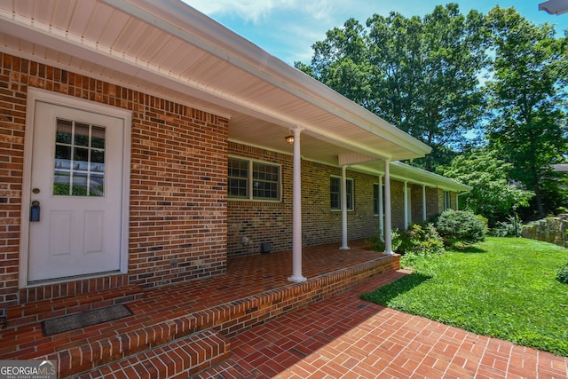 2722 Hidden Valley Rd, Hiawassee, GA 30546 - property entrance featuring brick siding and a yard