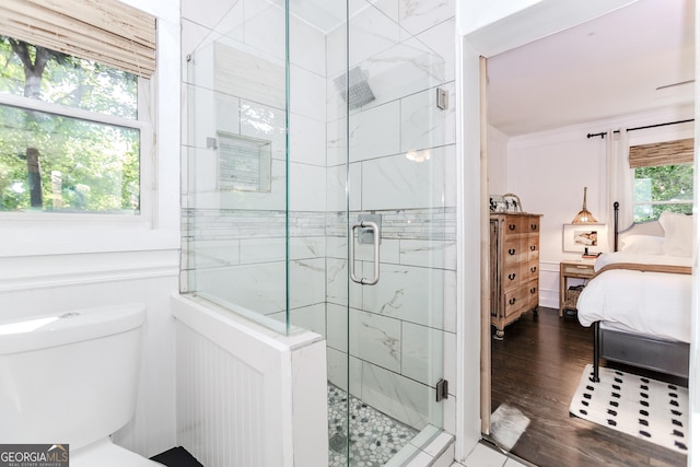 706 Powder Springs St SE, Smyrna, GA 30080 - ensuite bathroom with a stall shower and wood finished floors