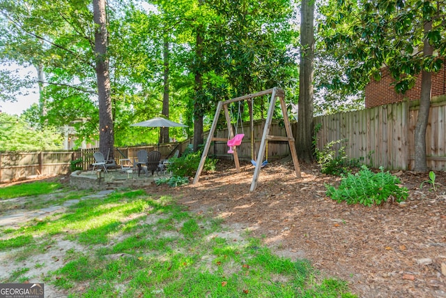 706 Powder Springs St SE, Smyrna, GA 30080 - fenced backyard with a patio and a playground