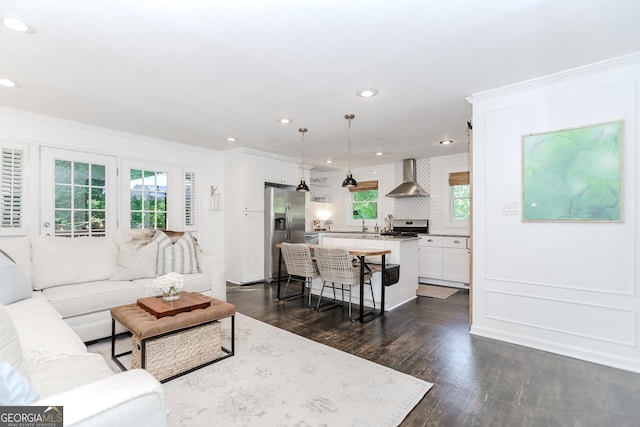 706 Powder Springs St SE, Smyrna, GA 30080 - living area with dark wood finished floors, crown molding, and recessed lighting