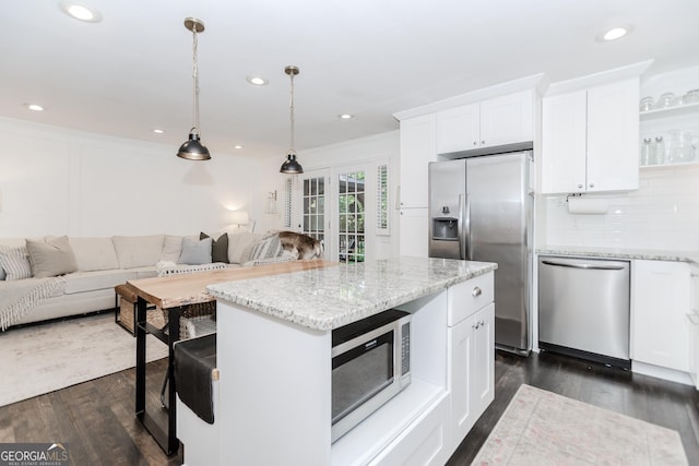 706 Powder Springs St SE, Smyrna, GA 30080 - kitchen with stainless steel appliances, open floor plan, white cabinets, recessed lighting, and crown molding