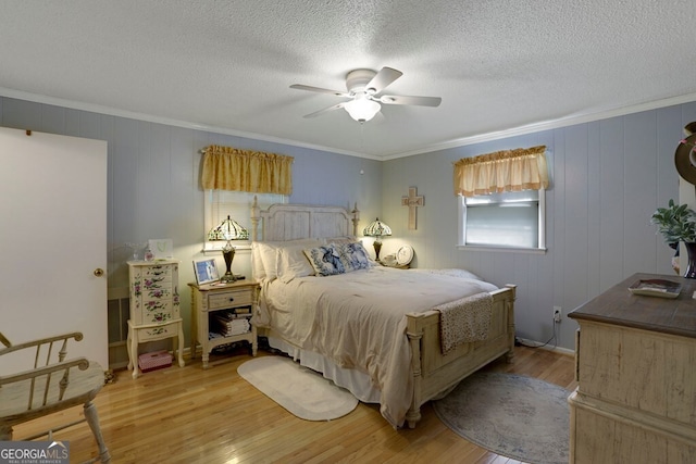 16 Lois Ln, Hayesville, NC 28904 - bedroom with crown molding, light wood finished floors, a ceiling fan, and a textured ceiling