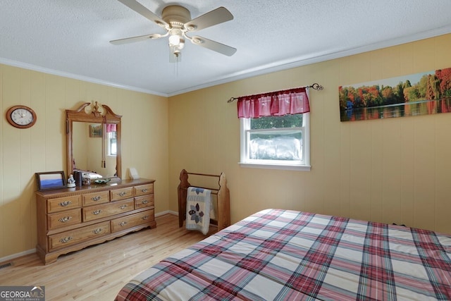 16 Lois Ln, Hayesville, NC 28904 - bedroom with light wood-style flooring, ornamental molding, a textured ceiling, and a ceiling fan