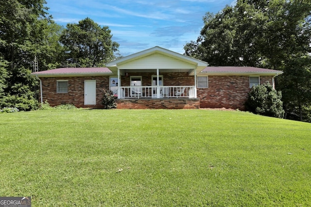 16 Lois Ln, Hayesville, NC 28904 - ranch-style home featuring a porch, a front yard, brick siding, and a metal roof