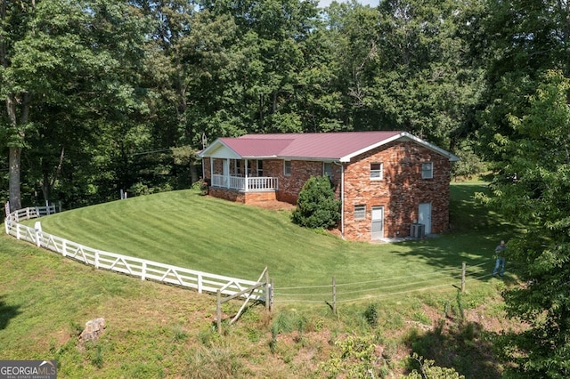 16 Lois Ln, Hayesville, NC 28904 - view of front of house featuring brick siding, covered porch, and a metal roof