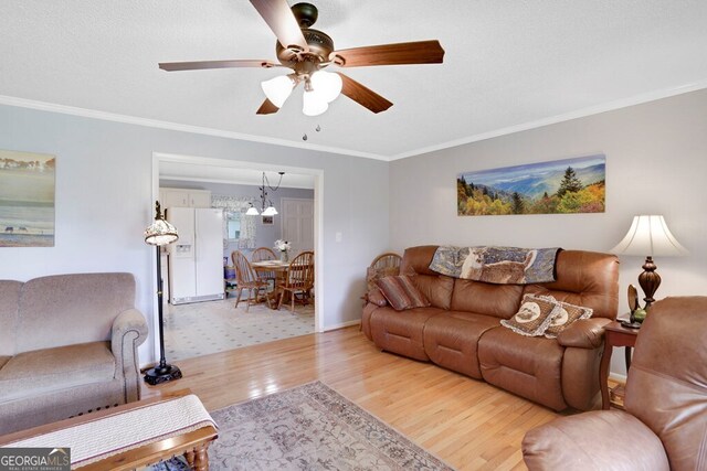 16 Lois Ln, Hayesville, NC 28904 - living area featuring wood finished floors, ornamental molding, and ceiling fan