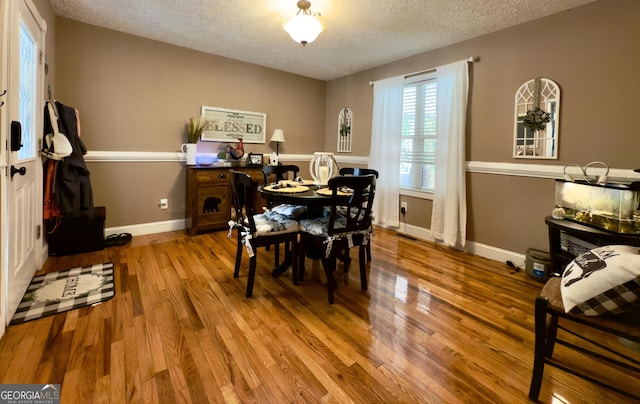 1780 Double Bridge Rd, Demorest, GA 30535 - dining space featuring a textured ceiling and wood finished floors