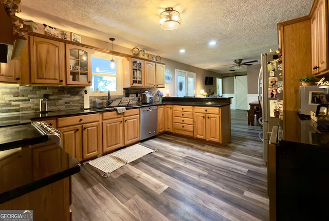 1780 Double Bridge Rd, Demorest, GA 30535 - kitchen featuring dishwasher, a peninsula, a textured ceiling, ceiling fan, and dark countertops