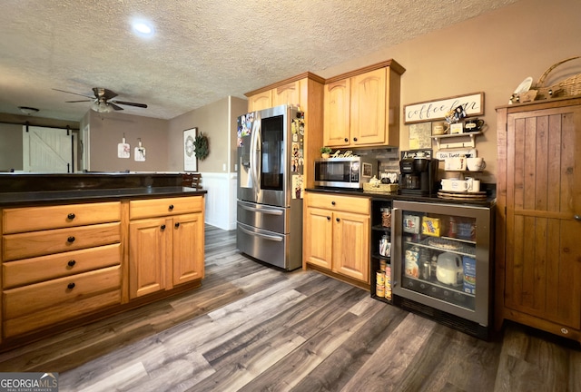 1780 Double Bridge Rd, Demorest, GA 30535 - kitchen with appliances with stainless steel finishes, dark countertops, dark wood finished floors, ceiling fan, and a textured ceiling