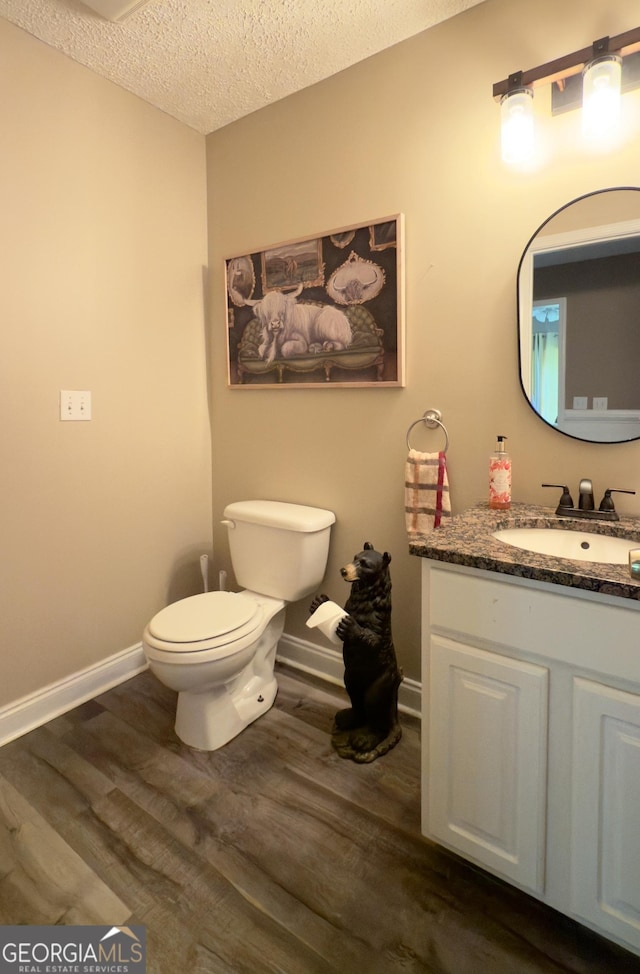 1780 Double Bridge Rd, Demorest, GA 30535 - half bath with wood finished floors, a textured ceiling, and vanity
