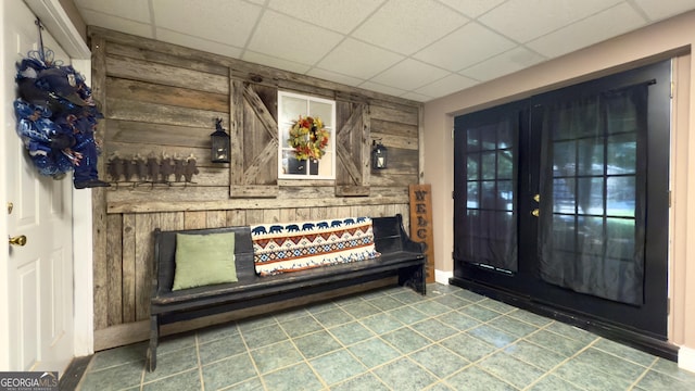 1780 Double Bridge Rd, Demorest, GA 30535 - foyer entrance featuring wood walls, a drop ceiling, and tile patterned floors
