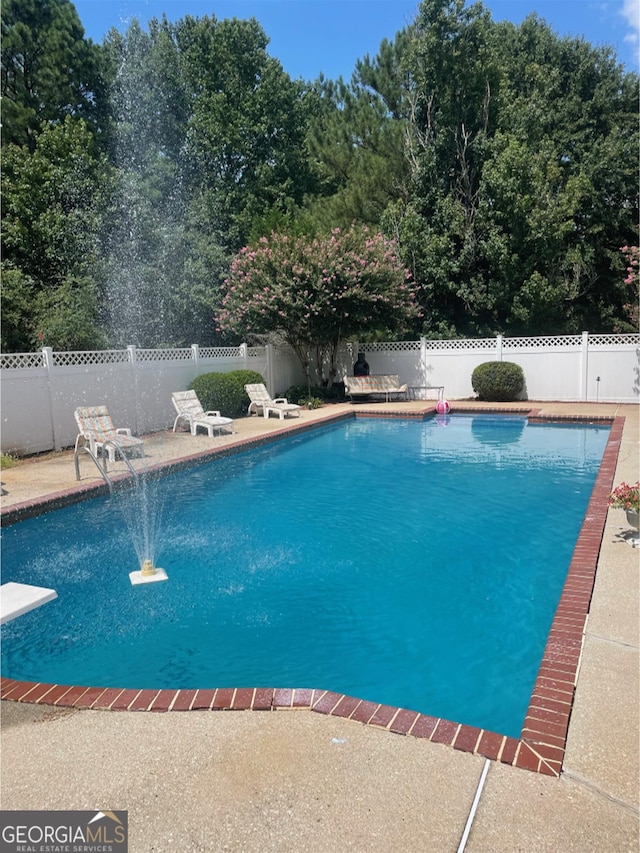 1417 Doe Valley Dr, Lithonia, GA 30058 - view of pool featuring a fenced backyard and a patio