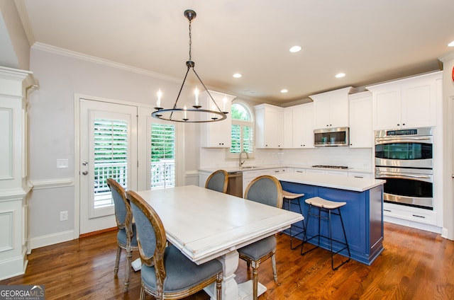 4645 Wykeshire Ct, Cumming, GA 30041 - dining room with a chandelier, ornamental molding, recessed lighting, and dark wood finished floors
