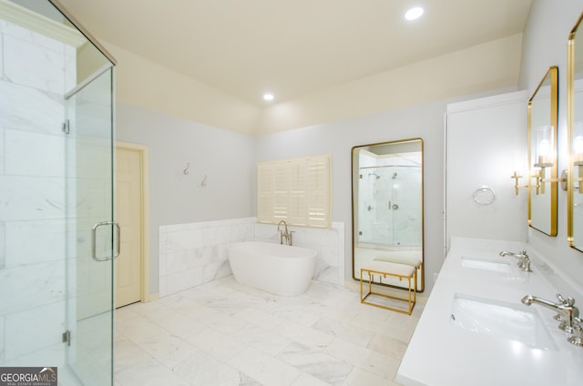 4645 Wykeshire Ct, Cumming, GA 30041 - full bathroom featuring a freestanding bath, a stall shower, double vanity, recessed lighting, and tile walls