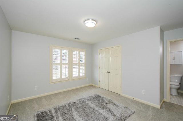 4645 Wykeshire Ct, Cumming, GA 30041 - unfurnished bedroom featuring carpet floors, a closet, and ensuite bathroom