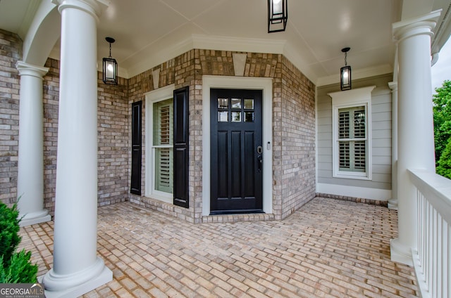 4645 Wykeshire Ct, Cumming, GA 30041 - property entrance featuring a porch and brick siding