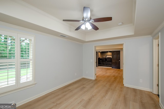 4645 Wykeshire Ct, Cumming, GA 30041 - unfurnished room with a ceiling fan, a raised ceiling, light wood-style flooring, and ornamental molding
