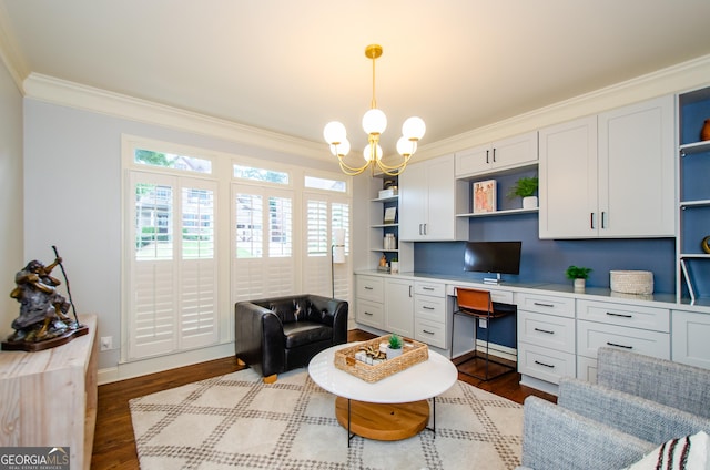 4645 Wykeshire Ct, Cumming, GA 30041 - home office with built in study area, ornamental molding, plenty of natural light, dark wood finished floors, and a chandelier