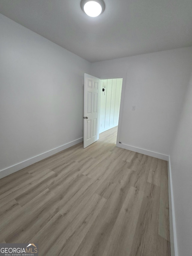 4749 Ga Highway 65, Pelham, GA 31779 - spare room featuring baseboards and light wood-type flooring