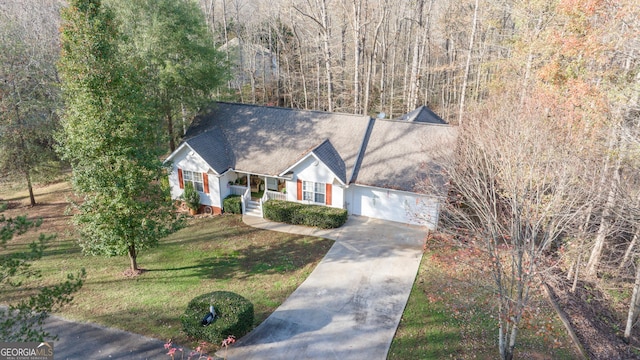127 Poplar Mill Rd, Demorest, GA 30535 - view of front of property with driveway, a front lawn, covered porch, a garage, and a shingled roof