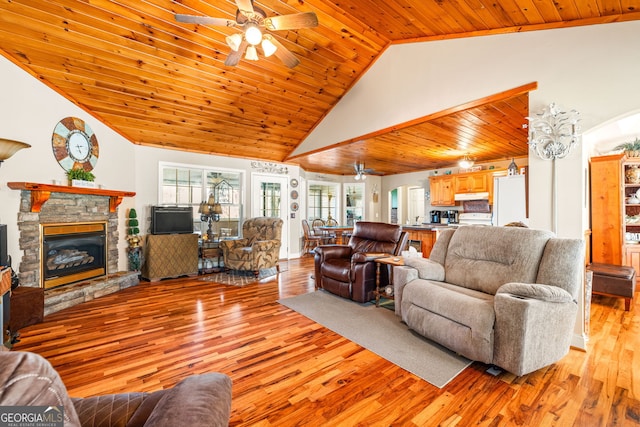 127 Poplar Mill Rd, Demorest, GA 30535 - living area featuring ceiling fan, light wood-style floors, a stone fireplace, wood ceiling, and high vaulted ceiling