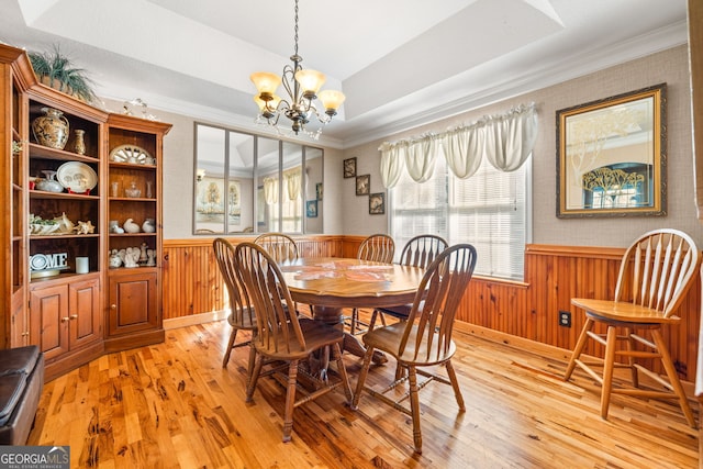 127 Poplar Mill Rd, Demorest, GA 30535 - dining area featuring a wainscoted wall, healthy amount of natural light, light wood-style flooring, a chandelier, and crown molding