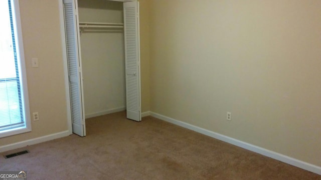 2297 Horseshoe Bend Rd SW, Marietta, GA 30064 - unfurnished bedroom with carpet and a closet