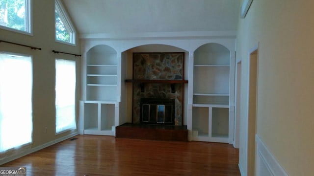 2297 Horseshoe Bend Rd SW, Marietta, GA 30064 - unfurnished living room featuring built in features, a fireplace, wood finished floors, and high vaulted ceiling