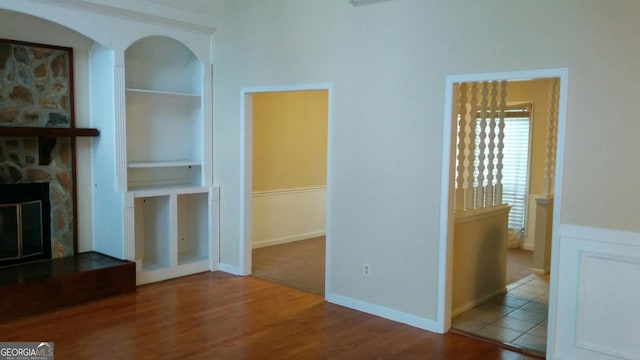 2297 Horseshoe Bend Rd SW, Marietta, GA 30064 - unfurnished living room featuring built in features, wood finished floors, and a fireplace