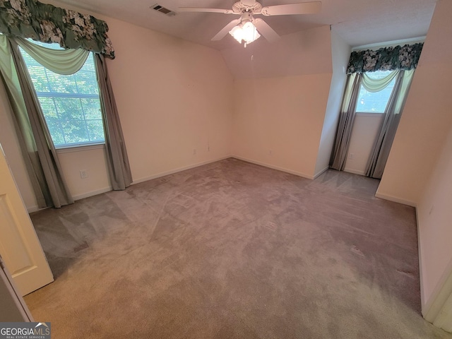 424 Ivey Edwards Ln, Mcdonough, GA 30253 - unfurnished room featuring light colored carpet, ceiling fan, and vaulted ceiling