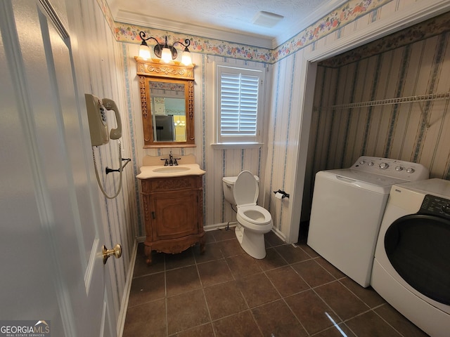 424 Ivey Edwards Ln, Mcdonough, GA 30253 - half bathroom with separate washer and dryer, wallpapered walls, tile patterned floors, vanity, and a textured ceiling