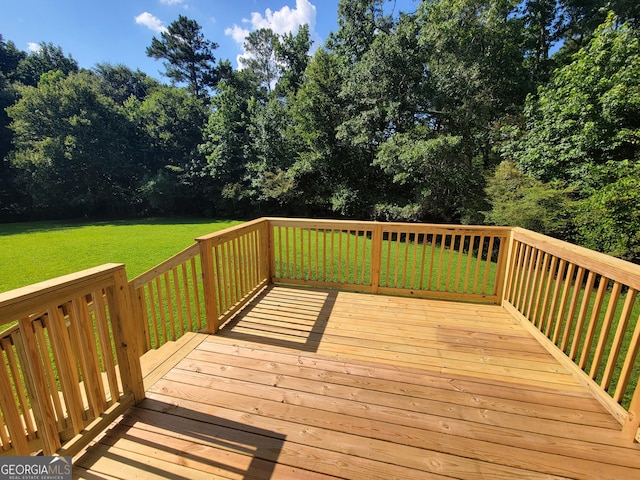 424 Ivey Edwards Ln, Mcdonough, GA 30253 - wooden deck with a lawn and view of wooded area