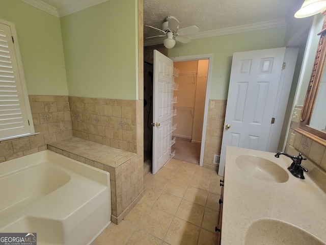 424 Ivey Edwards Ln, Mcdonough, GA 30253 - bathroom with a garden tub, tile patterned flooring, tile walls, a spacious closet, and double vanity