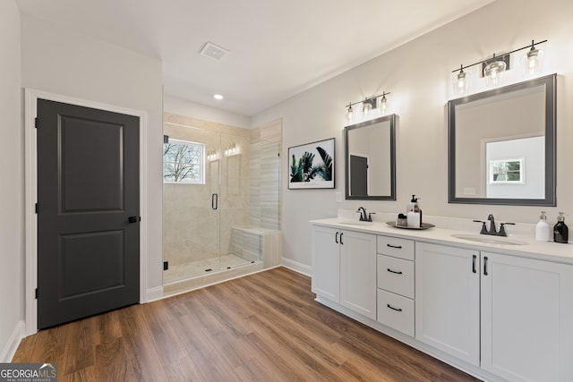 945 Willingham Dr Unit 3, Hapeville, GA 30354 - full bathroom featuring double vanity, a stall shower, wood finished floors, and recessed lighting