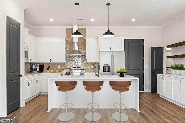 945 Willingham Dr Unit 3, Hapeville, GA 30354 - kitchen featuring appliances with stainless steel finishes, backsplash, a kitchen breakfast bar, light countertops, and crown molding